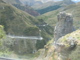 a frightening road between the mountain tops, in a bus